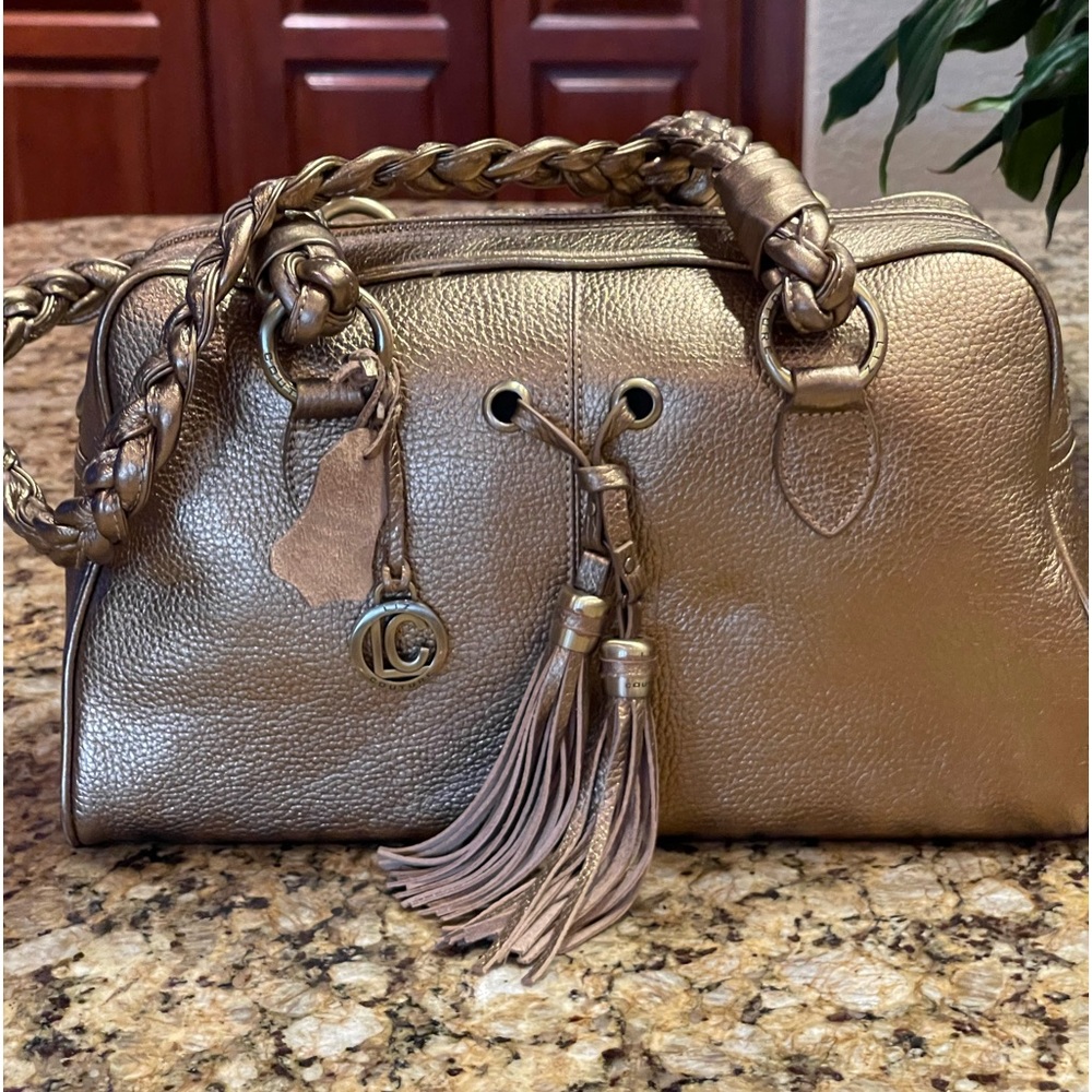 Beautiful brand new Liz Couture all leather handbag with unique hidden drawer